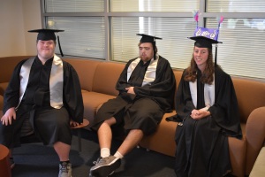 Ian, Jared & Michela are at Path to Interdependence Graduation they are sitting on couch.